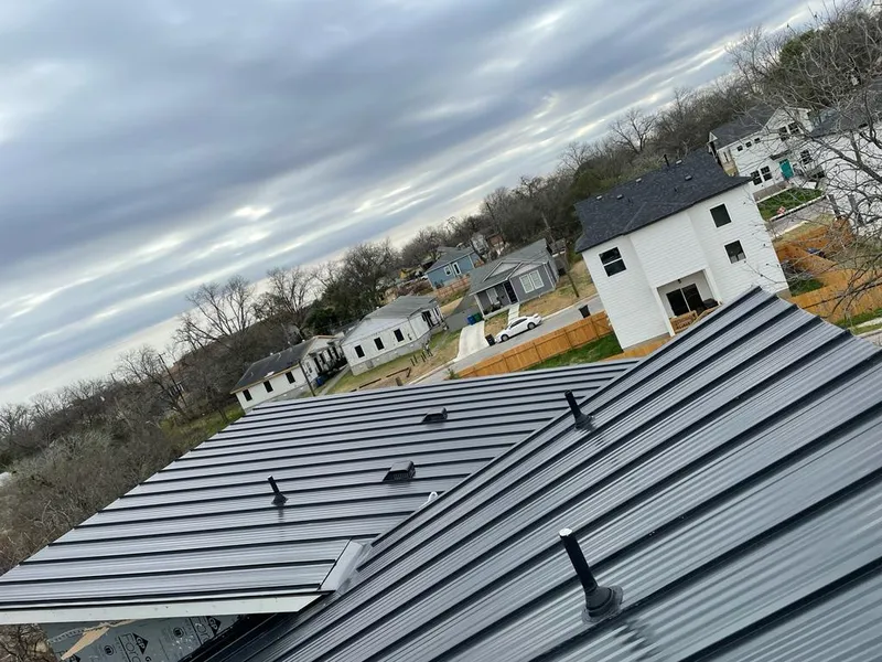 Standing seam metal roof panels with vents for Skylight Repair in Manville